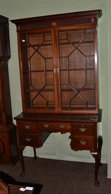 Lot 1226 - A 19th century style mahogany bookcase on lowboy