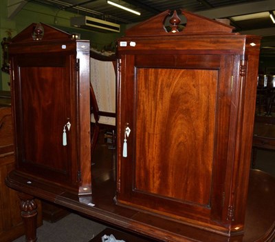 Lot 1252 - Pair of mahogany hanging corner cupboards, each with broken pediments and inlaid with ivory