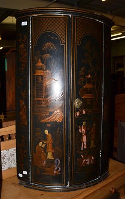 Lot 1256 - A 19th century chinoiserie bow fronted hanging corner cupboard