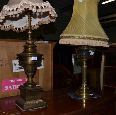 Lot 1275 - A gilt metal urn form table lamp on a plinth base together with a 19th century oil lamp...