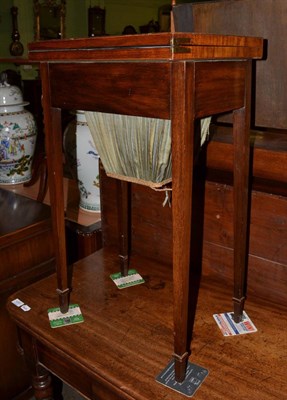 Lot 1280 - A Victorian rosewood fold-over swivel top work table