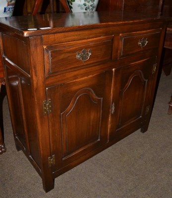 Lot 1282 - An oak two door cupboard