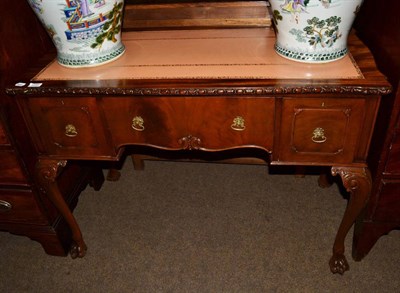 Lot 1288 - A reproduction mahogany leather top desk