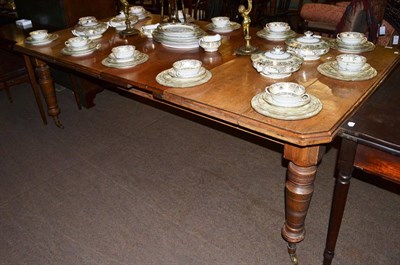 Lot 1304 - A 19th century oak wind-out dining table