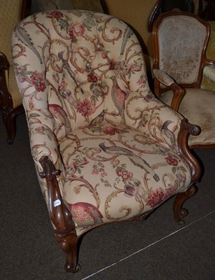 Lot 1321 - A Victorian walnut framed button back armchair