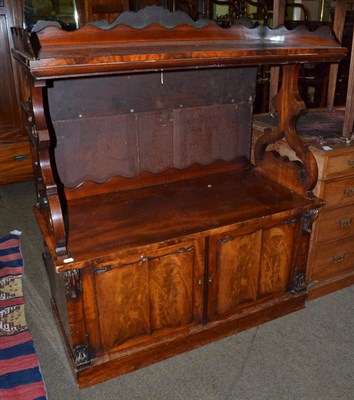 Lot 1357 - A 19th century mahogany buffet with scroll carved fielded panel doors