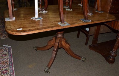 Lot 1360 - A 19th century cross-banded mahogany pedestal table