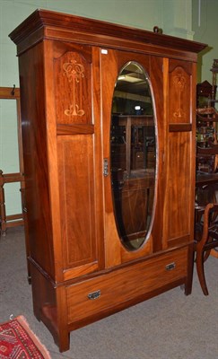 Lot 1366 - An early 20th century mahogany mirror fronted wardrobe with Art Nouveau inlay