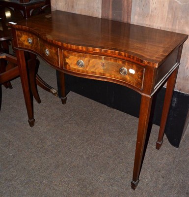 Lot 1367 - A brass inlaid mahogany serpentine fronted side table