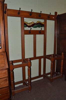 Lot 1375 - An early 20th century oak hall stand, with leaded and coloured glass central panel