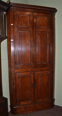 Lot 1377 - An 18th century free standing corner cupboard