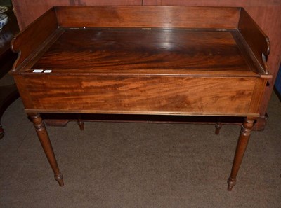 Lot 1396 - A 19th century mahogany washstand, the galleried top with hinged cover opening to reveal cut...