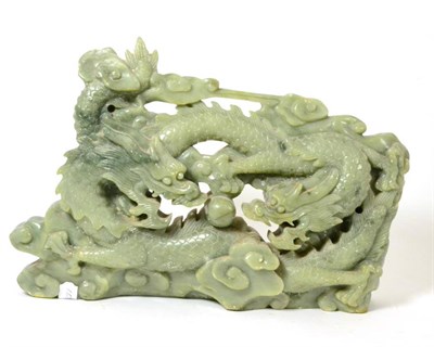 Lot 12 - A Chinese jade type dragon plaque