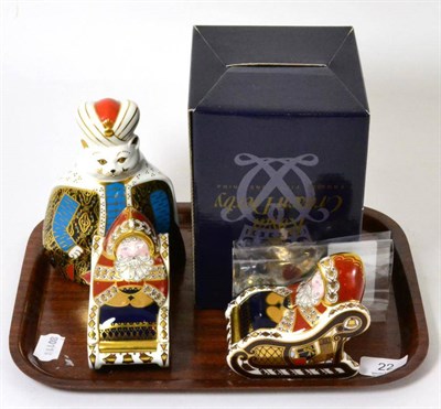 Lot 22 - A Royal Crown Derby paperweight from Royal Cats ";Persian"; (boxed) and two Royal Crown Derby Santa