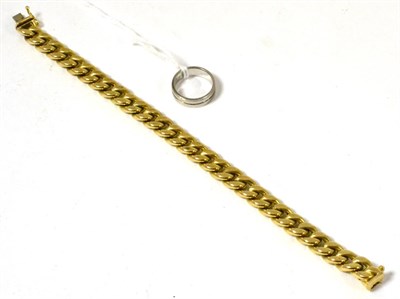 Lot 70 - A curb link bracelet stamped 585 and a ring stamped 585