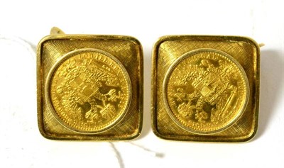 Lot 72 - A pair of coin set cufflinks