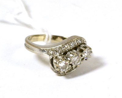 Lot 74 - A diamond three stone twist ring