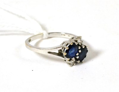 Lot 75 - A sapphire and diamond ring stamped '750'
