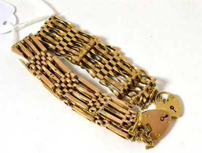 Lot 104 - A gate bracelet with padlock and another (2)