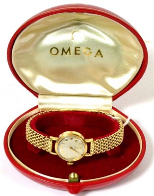 Lot 105 - A lady's Omega 9ct wristwatch, associated bracelet, cased
