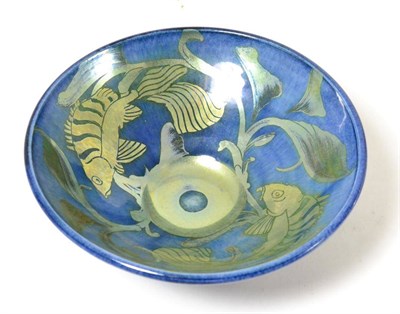 Lot 127 - A studio pottery bowl, by Jonathan Chiswell Jones, decorated with silver lustre fish on a blue wash