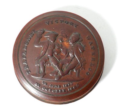 Lot 128 - A 19th century turned wooden snuff box commemorating Wellington's victory over Napoleon