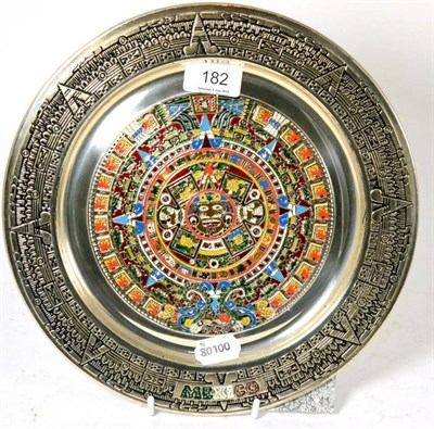 Lot 182 - An enamelled Mexican white metal charger