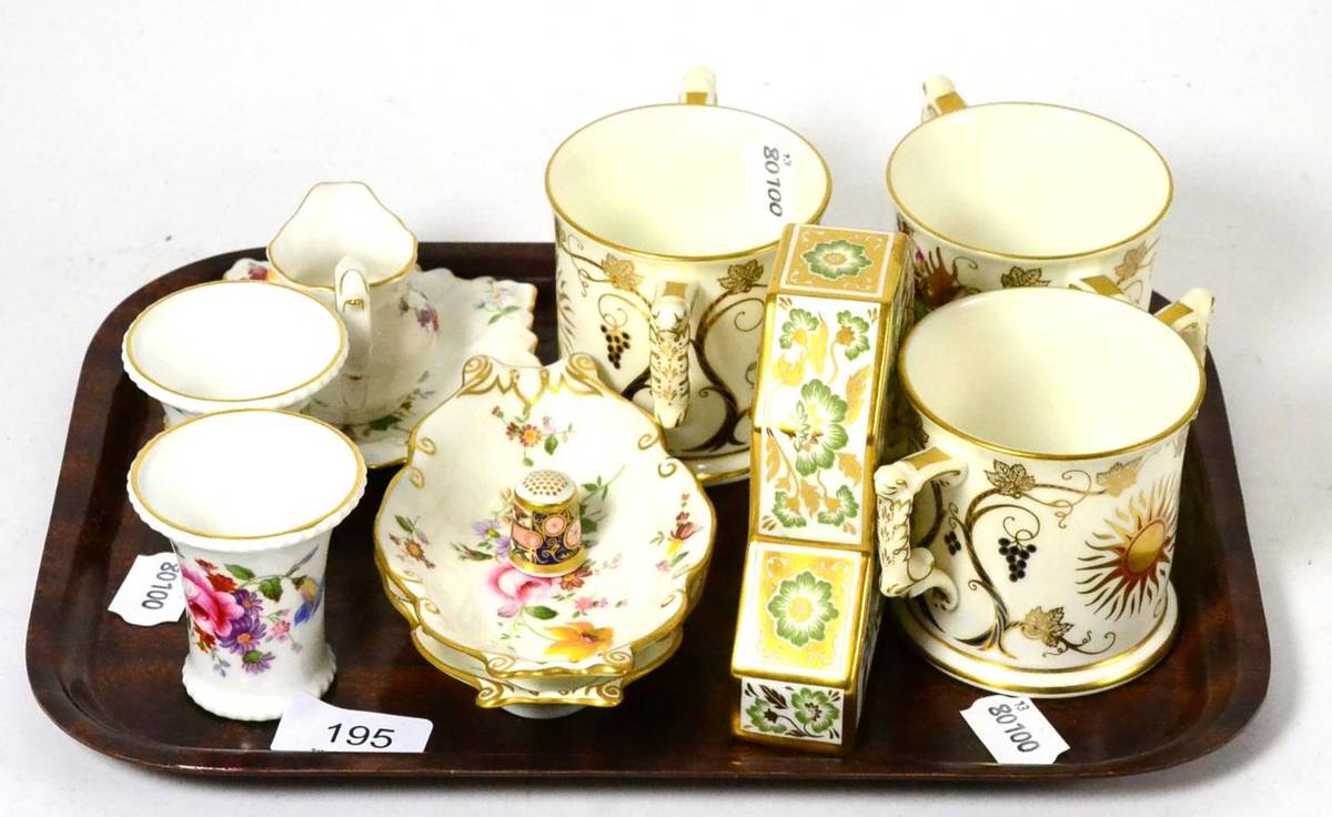 Lot 195 - A tray of Royal Crown Derby porcelain including three loving cups, a small mantle timepiece,...