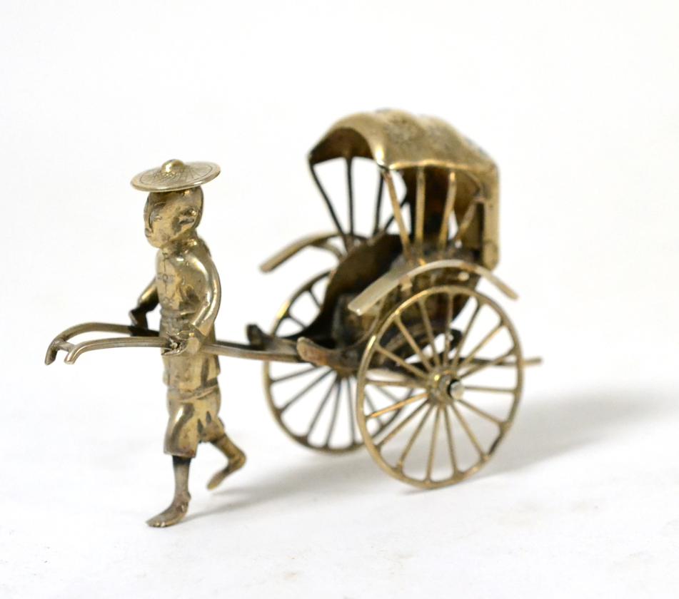 Lot 227 - A Chinese silver model of a rickshaw and driver