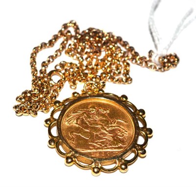 Lot 11 - A gold full sovereign dated 1907, contained in a 9ct gold pendant, on chain, the chain clasp...
