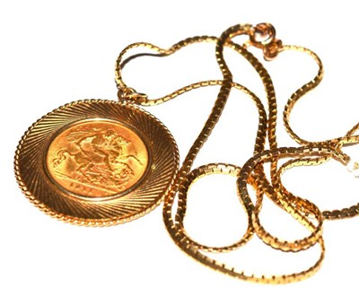 Lot 18 - A 1911 gold half sovereign in 9ct mount on chain