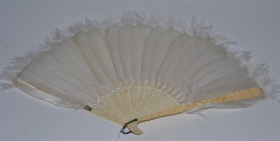 Lot 121 - A Chinese carved ivory feather fan late 19th century/early 20th century, small repair