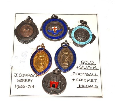 Lot 123 - A 9ct gold and enamel football medal and five silver examples