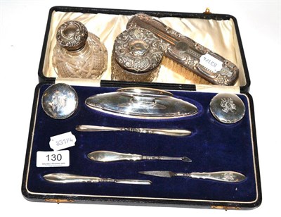 Lot 130 - A cased silver manicure set, Birmingham 1919; with three other dressing table items