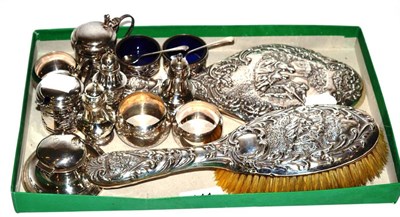 Lot 141 - Assorted silver including napkin rings, condiments, brush and mirror set etc