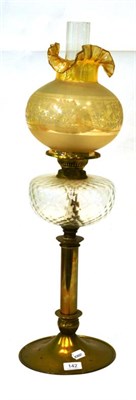 Lot 142 - A Victorian brass oil lamp with etched glass shade