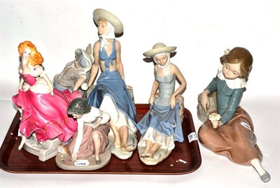 Lot 149 - A collection of porcelain figures comprising a Franklin Mint Cinderella; two Nao figures of...