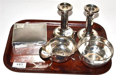 Lot 157 - Silverwares comprising engine engraved cigarette box, pair of candlesticks, sauce boat and circular