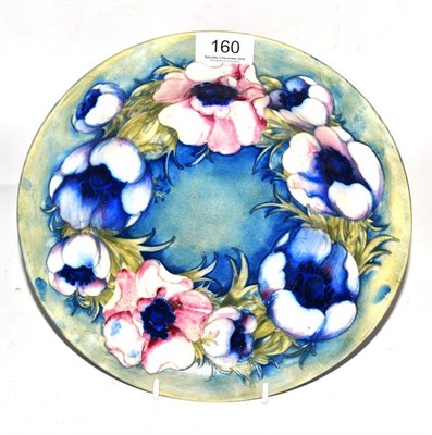 Lot 160 - A William Moorcroft Anemone pattern bowl, blue salt glaze ground, brown painted signature and...