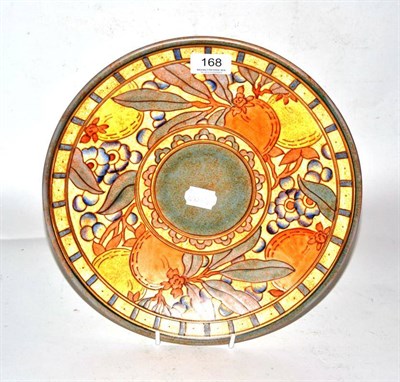 Lot 168 - A Bursley Ware charger, designed by Charlotte Rhead, decorated with autumn fruit, printed...