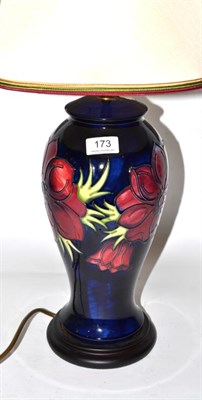 Lot 173 - A Moorcroft Anemone pattern table lamp, on a blue ground, 35cm excluding fittings