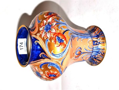 Lot 174 - A Macintyre Moorcroft Florian Ware Alhambra pattern vase, circa 1903, in typical salmon, blues...