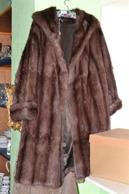 Lot 197 - A brown fur coat, another with mink collar and two mink hats (4)