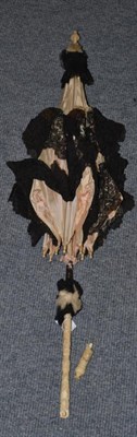 Lot 198 - Late 19th century carved ivory handled parasol, with silk and black lace mount (a.f.)