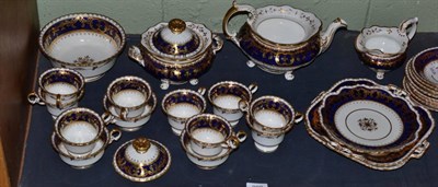 Lot 208 - An early 19th century tea set, probably Coalport, white ground with cobalt blue bands,...