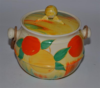 Lot 217 - A Clarice Cliff Delecia Citrus pattern biscuit barrel, model 335, wicker handle, moulded and...