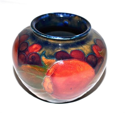 Lot 219 - A William Moorcroft Pomegranate pattern vase, green painted monogram, 6.5cm