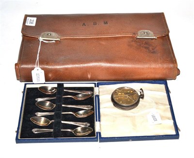 Lot 238 - A Mappin & Webb leather travelling vanity case containing a composite silver plate topped set; also