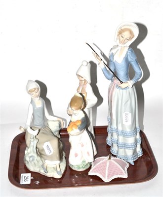 Lot 253 - Four Lladro china figural ornaments including lady with parasol