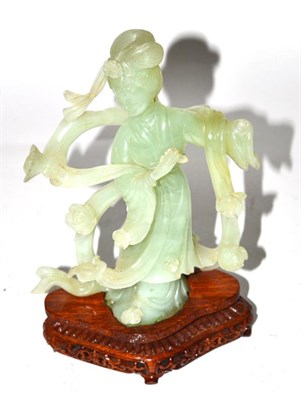 Lot 259 - A Chinese carved green hardstone figure of a lady, on wooden base